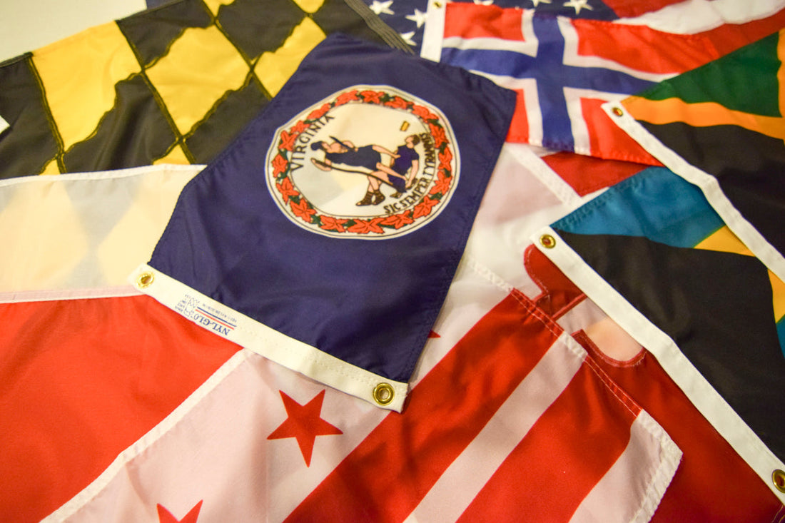 “Virginia state flag showing Virtus standing over Tyranny, produced by Kengla Flag Company.