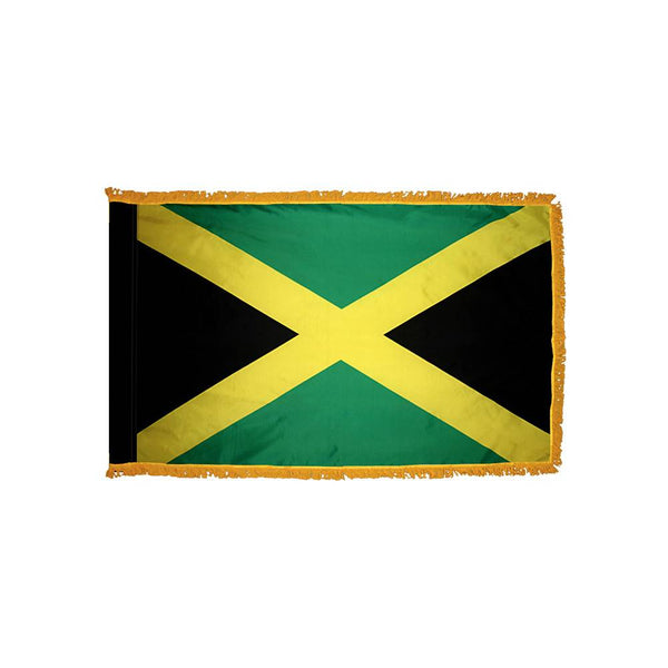 Outdoor Jamaica flag with gold saltire and green and black panels, designed for durable display on a flagpole.
